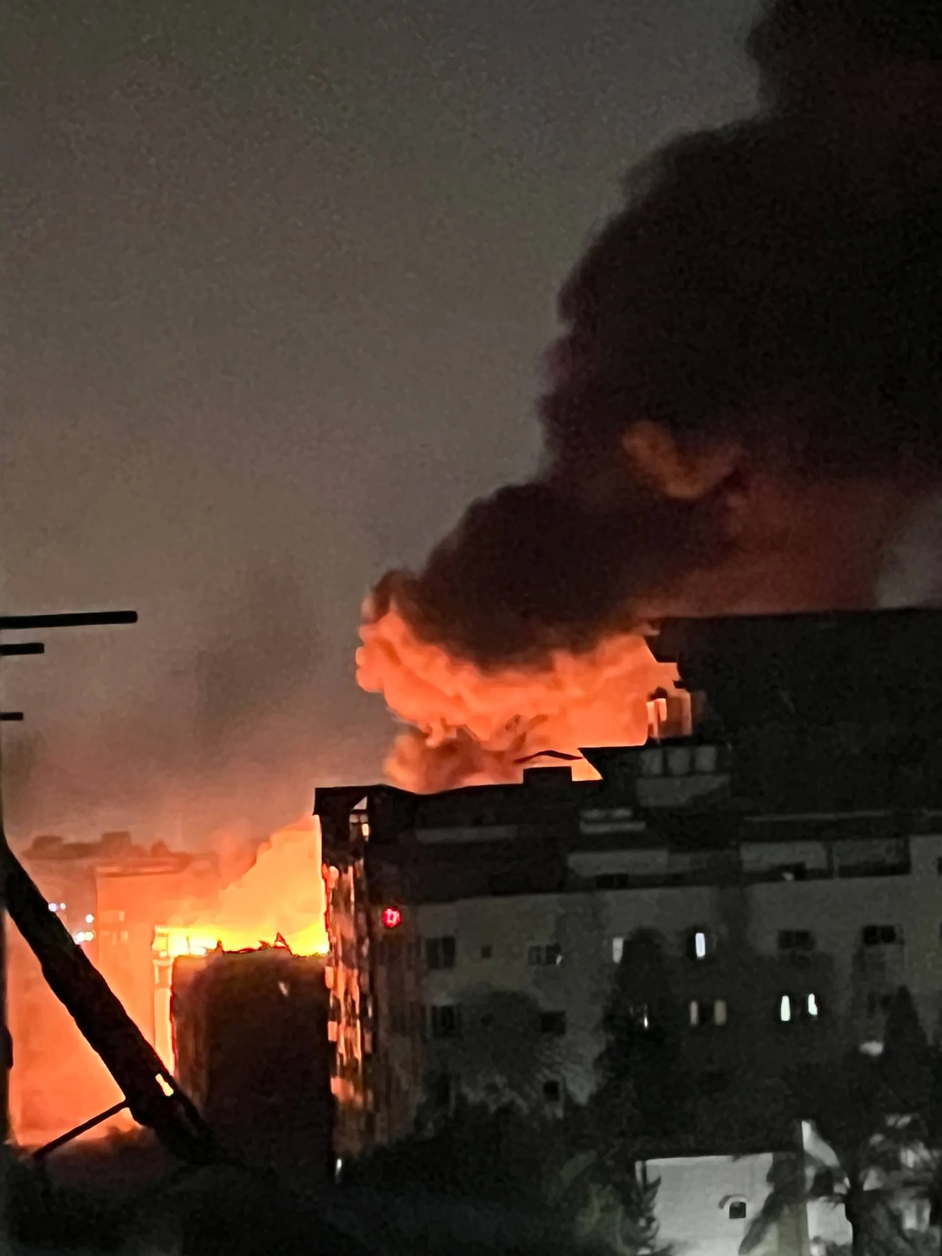 The neighbouring building burning — for two days, night and day